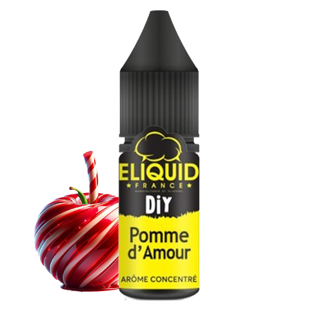 Description de l'image : L'image présente une pomme avec un bâton de sucre d'orge enroulé autour, placée devant une bouteille d'Eliquid DIY Pomme d'Amour. La pomme est rouge et blanche, et le sucre d'orge ajoute une touche festive à la scène. La bouteille d'Eliquid est noire et jaune, positionnée à droite de la pomme. Dans l'ensemble, la scène apparaît comme un affichage créatif et ludique, peut-être lié à une fête ou à une célébration.